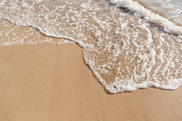 Maui Hawaii beach coastline of sand, sun, and blue water with crashing