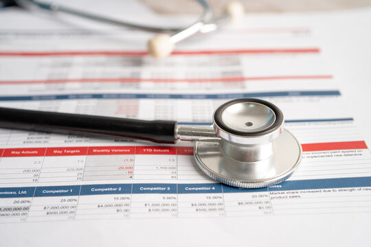 Stethoscope on spreadsheet paper, Finance, Account, Statistics, Investment, Analytic research data economy spreadsheet and Business company concept.