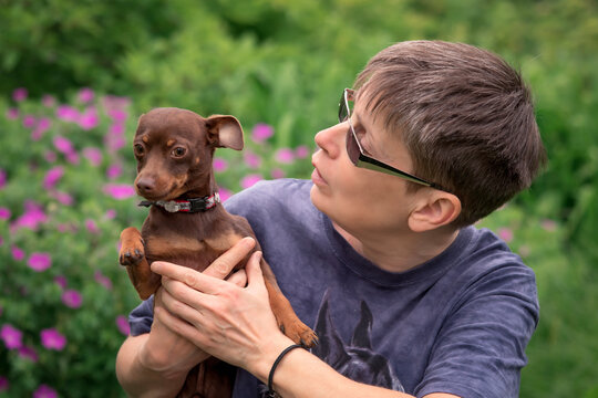 Woman with Prague rattier dog