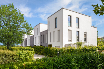 Modern townhouses in a residential area, new apartment buildings with green outdoor facilities in the city