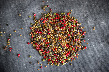 peppercorns 5 spices red, black, green and white pepper, coriander fresh healthy meal food snack diet on the table copy space food background rustic top view