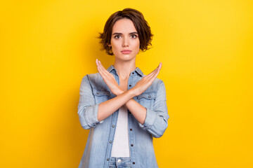 Photo of young pretty serious woman crossed hands show no stop forbidden symbol isolated over...
