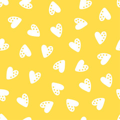 Yellow seamless pattern with white hearts.