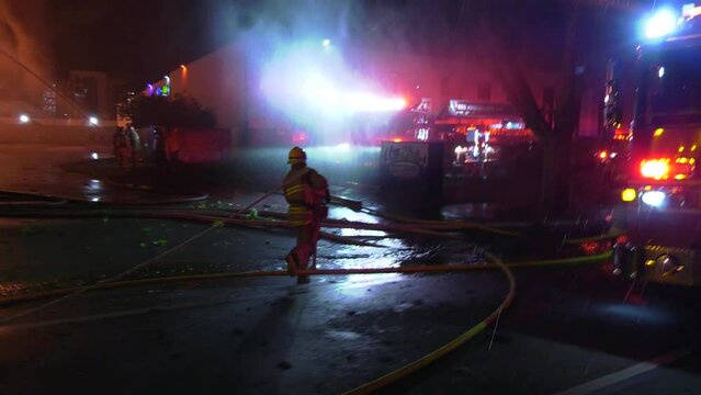 firefighters rush to extinguish large blaze