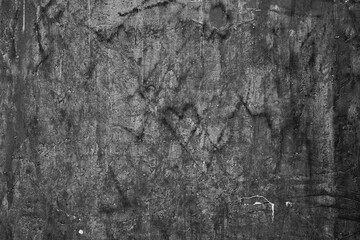 Defocused focus Abstract pattern of hearts, Grunge beautiful black wall with cracks on the plaster with space for text or image. Abstract drawings of hearts, lines and cracks on the background. The