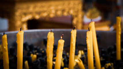 burning candles in a buddhist temple