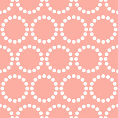 Seamless pattern with white dots and pink background