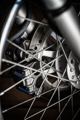 Detail of wheel and disc brakes of modern motorcycle