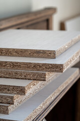 White melamine stack in kitchen furniture factory