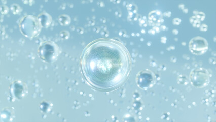 A macro shot of many essential water bubbles rising on a light blue background. Beautiful shiny...