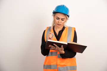 Displeased worker checking important notes on white background