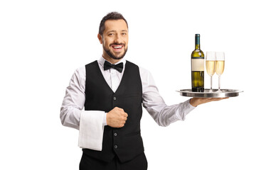 Smiling waiter holding bottle of wine and glasses on a tray