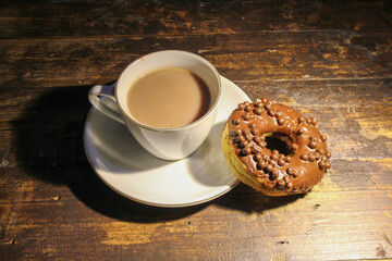 chocolate donut and a cup of chocolate milk