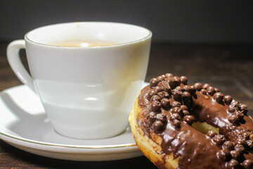 chocolate donut and a cup of chocolate milk