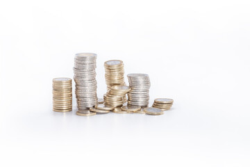 abundance of money, columns of one and two euro coins on a white background