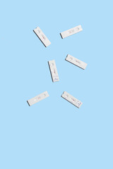 Rapid test group for sars covid 19, antigen test used with its different results on a light blue...