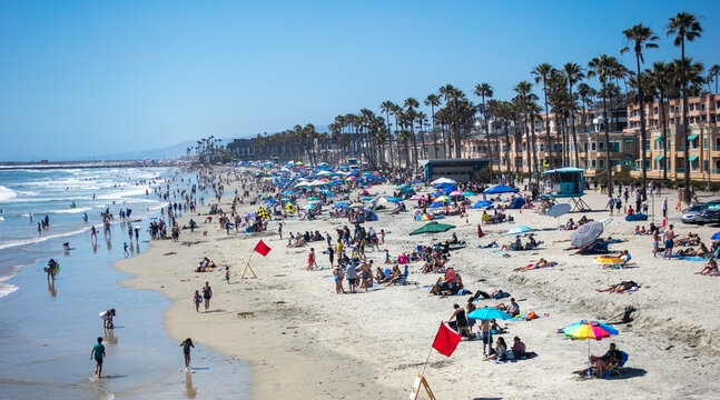 The Beach at Oceanside, California,  Crowded with People on Vacation enjoying the Shore