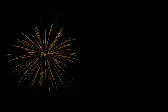 Colorful fireworks celebration in the night sky with free space for text
