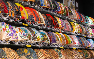 shop with colorful fans for tourists