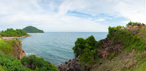 A beautiful viewpoint of the sea and a tropical island with cliffs and rocks at Noen Nang Phaya Viewpoint at Chalerm Burapha Chonlathit Highway, Chanthaburi, Thailand, panorama.