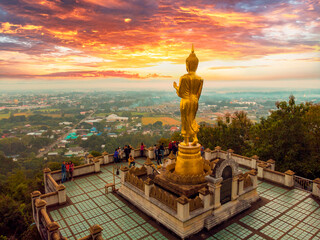 Statue of buddha at sunrise, Wat Phra That Khao Noi, Nan province, Thailand.