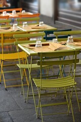 empty restaurant tables set in the terrace waiting customers for dinner