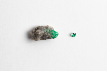 Natural Raw Green Emerald in Matrix Specimen and cut Gemstone Isolated on White Background