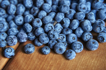 Fresh blueberry background. close up texture blueberry berries on wooden table . Blueberry antioxidant organic superfood, concept for healthy eating and nutrition
