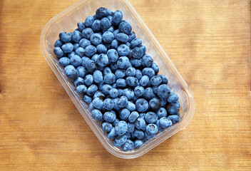Delicious ripe blueberries lie in basket