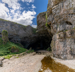 view of the landmark Smoo Cave on the coast of the northwestern Scottish Higlands