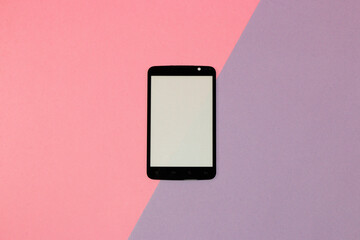 mobile phone with copy space on pastel pink-purple background, creative modern design, techno...