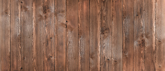 Naklejka premium banner made of dark brown vertical wooden boards. view from above.