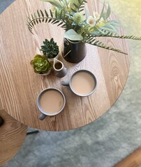 two cups of coffee on the table and decoration