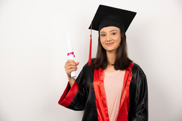 Fresh graduate with diploma posing on white background