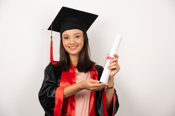 Female student showing diploma on white background