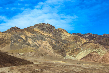 Colorful Mountains Under Cloudy Blue Sky in Death Valley National Park - Powered by Adobe