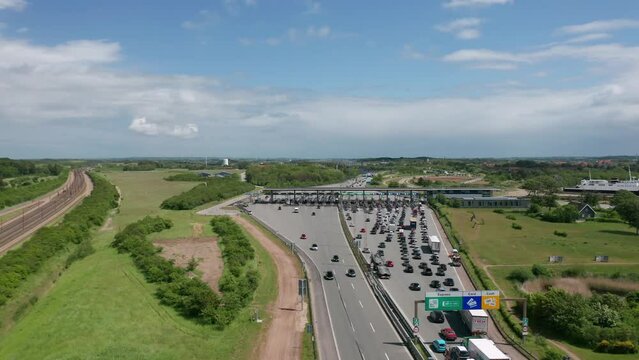 Aerial view on the traffic at the toll collection point (toll booth) on the highway near the Great Belt bridge (&Oslash;stbroen) in Denmark