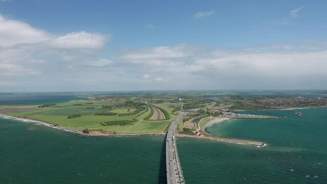Aerial view on the Zealand shore: toll booth at the famous Great Belt suspension bridge (&Oslash;stbroen) and railway entrance to the underwater tunnel for trains. Denmark
