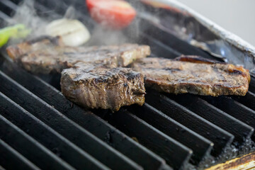 beef steaks on the grill