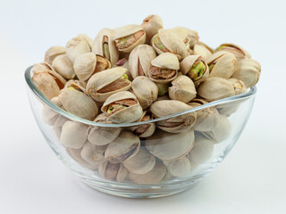 Pistachios in a glass bowl.