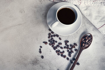 Cup of coffee and coffee beans background. Food and beverage concept.