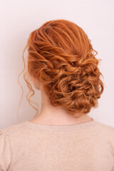 
Female back with red hairstyle on hairdressing salon background
