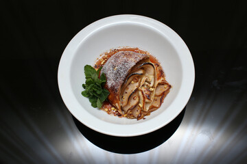 delicious appetizing food dish   meat cake roll pie on a plate in a restaurant