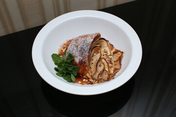 delicious appetizing food dish   meat cake roll pie on a plate in a restaurant