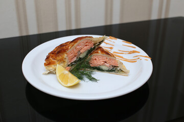 delicious appetizing food dish   meat cake roll pie on a plate in a restaurant