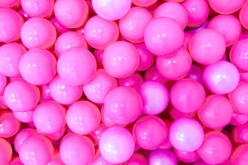 Pink plastic balloons. Isolated pink color background. Monochromatic concept.