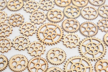 Background wooden gears on white background.