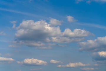 Beautiful white clouds on a bright blue background.