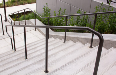 Stairway with steel banister to apartment complex from top of stair way 2