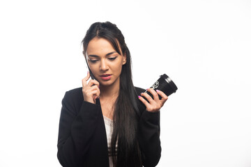 Business woman talking on cellphone on white background